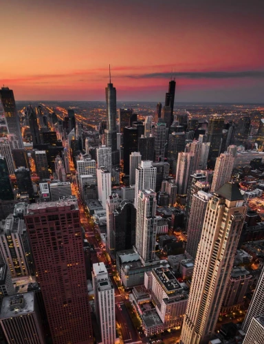 City skyline illuminated by lights at night.