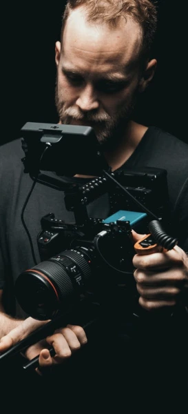 A guy holding a camera.