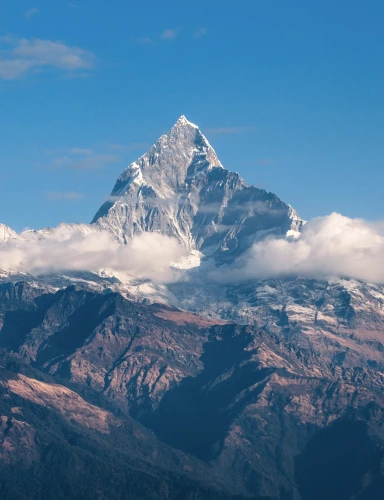 Snow-capped mountain peaks against a clear sky.